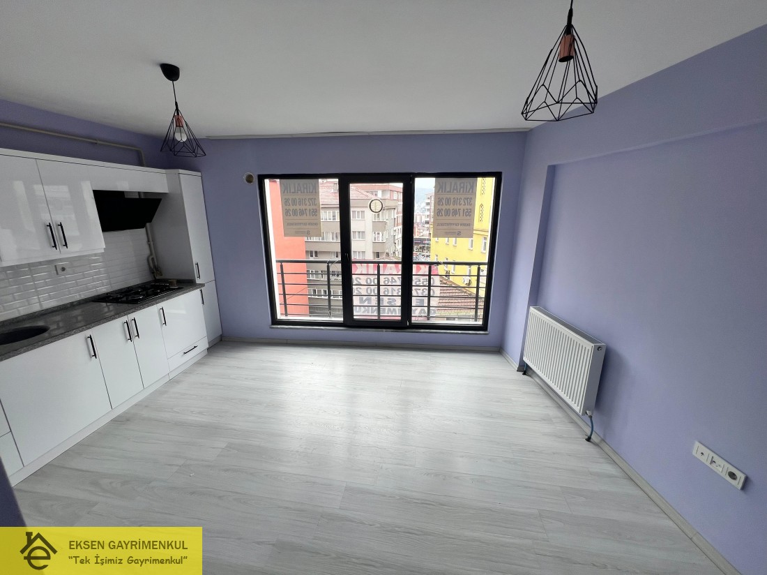 ERDEMİR CADDESİ ÜZERİNDE SIFIR AYARINDA KİRALIK  1+1DAİRE